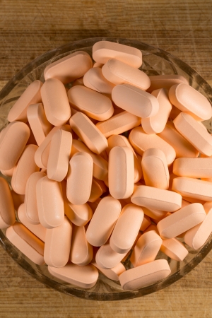 Colored Pills In A Glass Bowlの写真素材