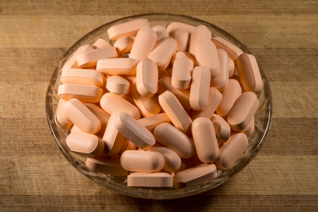 Colored Pills In A Glass Bowlの写真素材