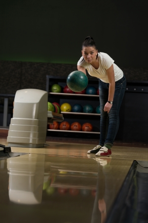Young Women Playing With A Bowling Ballの写真素材