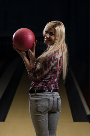 Women Holding A Bowling Ballの写真素材