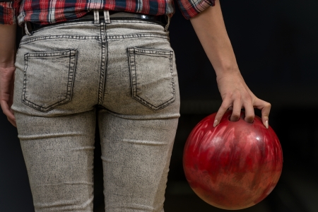 Close-Up Of A Butt Next To A Bowling Ballの写真素材