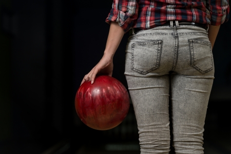 Close-Up Of A Butt Next To A Bowling Ballの写真素材