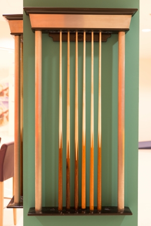 Pool Cues Billiard Against a Wallの写真素材