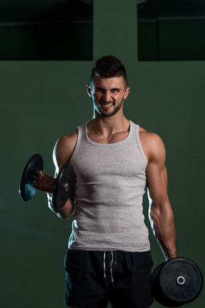 Young Men Doing Exercise For Bicepsの写真素材