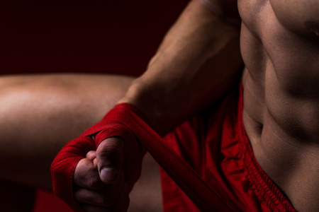 Kick Boxer Putting Straps On His Handsの写真素材