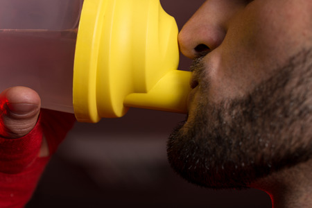 Muscular Men Drinking Water From Shakerの写真素材