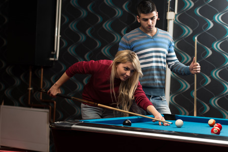 Couple Playing Billardの写真素材