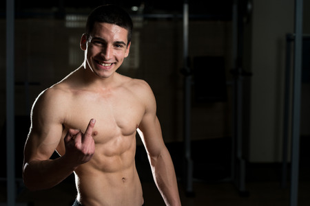 Young Man Holding Middle Fingerの写真素材