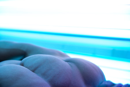 Young Muscular Man At Solarium In Beauty Salonの写真素材