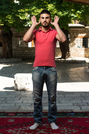 Muslim Man Is Praying In The Mosque Outdoorsの写真素材