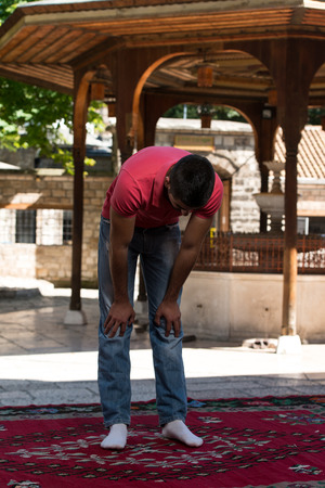 Muslim Man Is Praying In The Mosque Outdoorsの写真素材