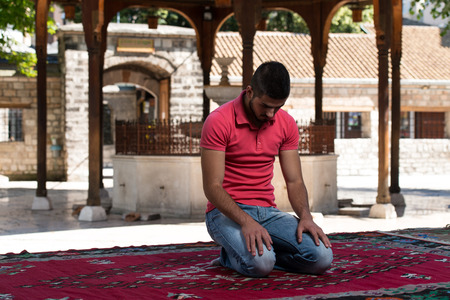 Muslim Man Is Praying In The Mosque Outdoorsの写真素材