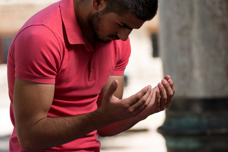 Muslim Man Is Praying In The Mosque Outdoorsの写真素材