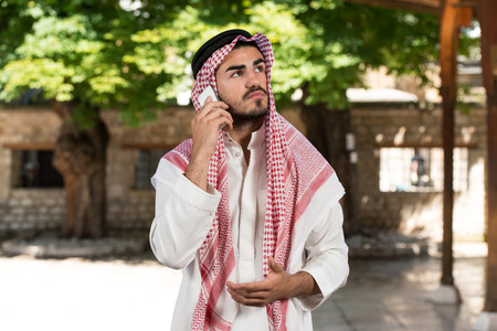 Young Businessman Wearing A Traditional Cap Dishdashaの写真素材
