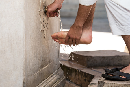 Muslim Man Preparing To Take Ablution In Mosqueの写真素材