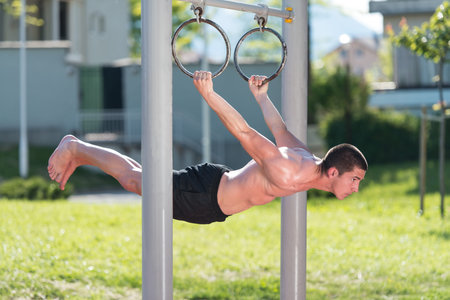 Handsome Muscular Young Man Workout In The Park
