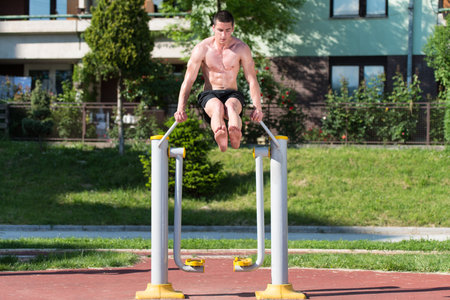 Handsome Muscular Young Man Workout In The Park