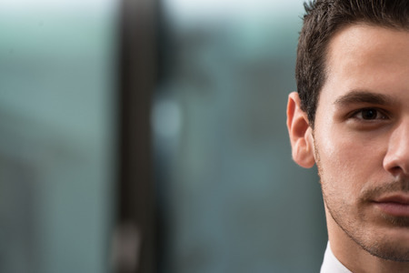 Portrait Half Of Face Of Young Businessmanの写真素材