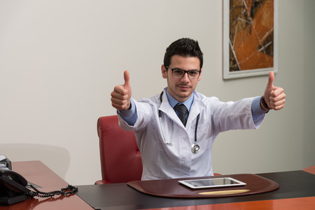 Happy Smiling Cheerful Doctor With Thumbs Up Gestureの写真素材