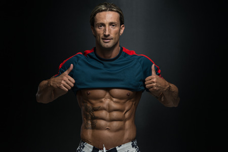 Portrait Of A Physically Fit Muscular Middle Age Man Without A Shirtの写真素材