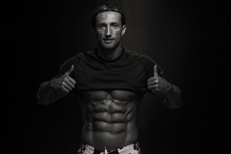 Portrait Of A Physically Fit Muscular Middle Age Man Without A Shirt