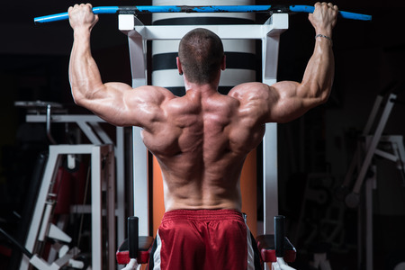 Male Bodybuilder Doing Heavy Weight Exercise For Backの写真素材
