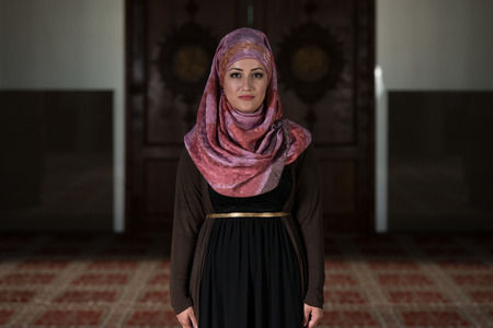 Young Muslim Woman Praying In Mosqueの写真素材