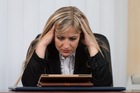 Young Business Woman With Problems And Stress In The Officeの写真素材