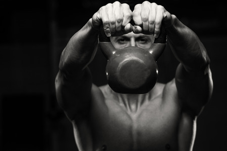 Athletic Man Workout With Kettle Bellの写真素材