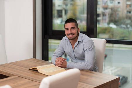 A Portrait Of An Caucasian College Student Man In Library - Shallow Depth Of Fieldの写真素材