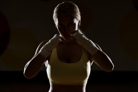Young Woman Boxer MMA Fighter Practice Her Skillsの写真素材