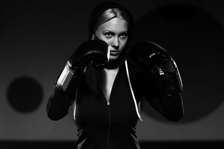 Young Woman Boxer MMA Fighter Practice Her Skills