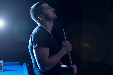 Young Man Looking Confused Lost His Billiard Gameの写真素材