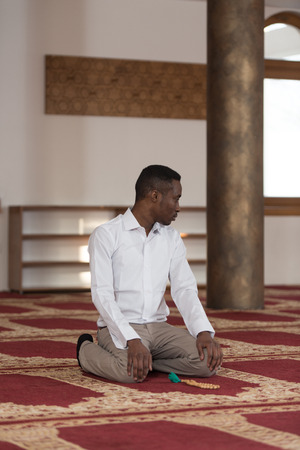 Black African Muslim Man Is Praying In The Mosqueの写真素材