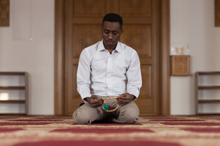 Black African Muslim Man Is Praying In The Mosqueの写真素材