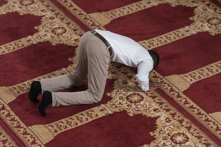 Black African Muslim Man Is Praying In The Mosqueの写真素材