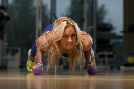 Middle Age Athlete Doing Pushups As Part Of Bodybuilding Training