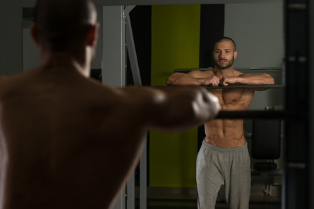 Good Looking And Attractive Young Man With Muscular Body Relaxing In Gymの写真素材