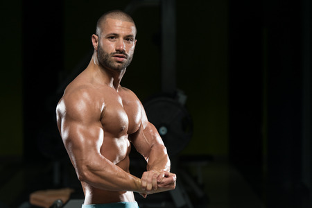 Portrait Of A Physically Fit Man Showing His Well Trained Bodyの写真素材