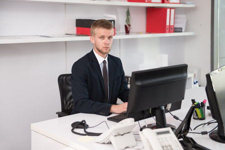 Happy Young Business Man Work In Modern Office On Computer