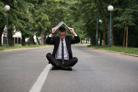 Furious Businessman Looking At His Laptop And Shouting Outの写真素材