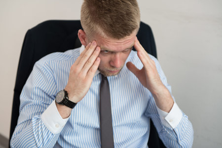 Young Business Man With Problems And Stress In The Office