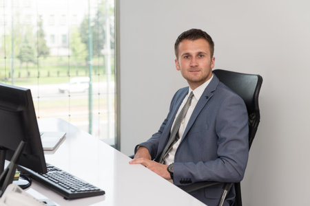 Happy Young Business Man Work In Modern Office On Computer