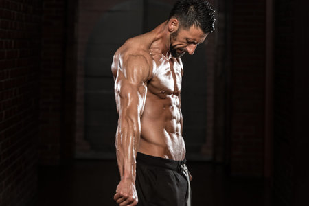 Portrait Of A Physically Fit Man Showing His Well Trained Body