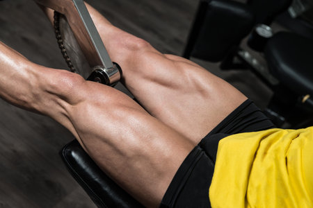 Man Doing Leg Exercises With Machine
