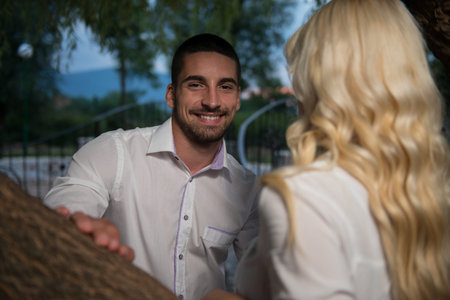 Young Couple In Love Outdoor - Stunning Sensual Outdoor Portrait Of Young Stylish Fashion Couple Posing In Summer In Fieldの写真素材