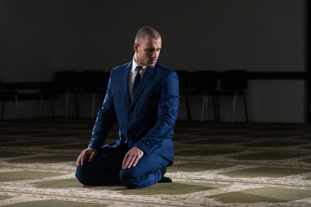 Businessman Muslim Making Traditional Prayer To God Allah In The Mosqueの写真素材
