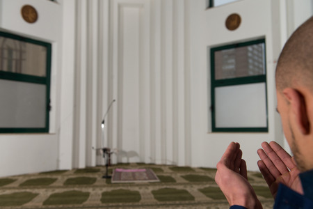 Businessman Muslim Making Traditional Prayer To God Allah In The Mosqueの写真素材