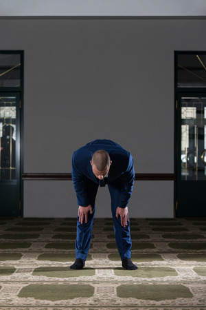 Businessman Muslim Making Traditional Prayer To God Allah In The Mosqueの写真素材