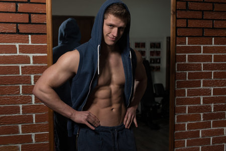 Portrait Of A Young Physically Fit Man Showing His Well Trained Body
